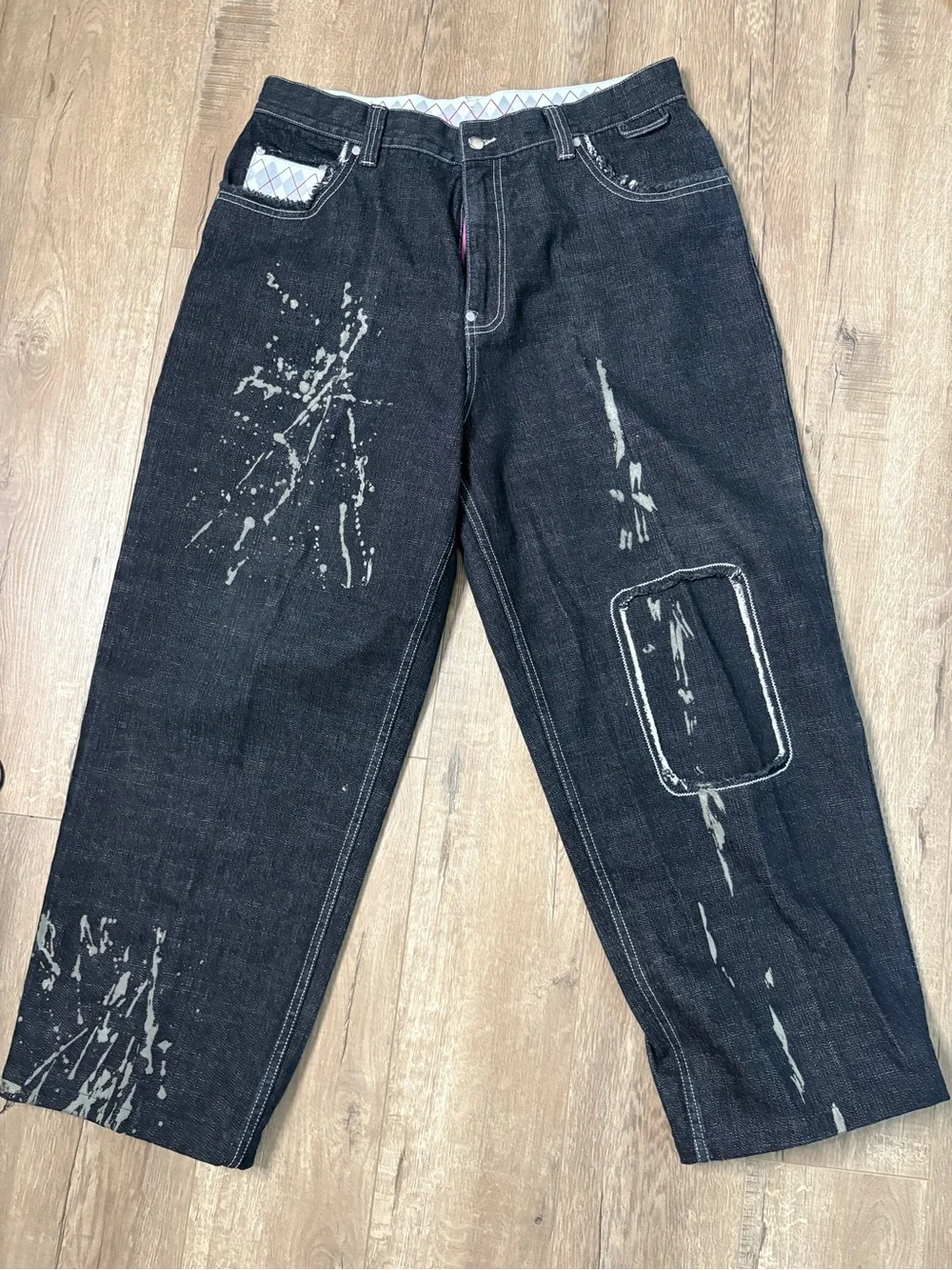 These wide-leg black jeans with white paint splatters Size 36x28